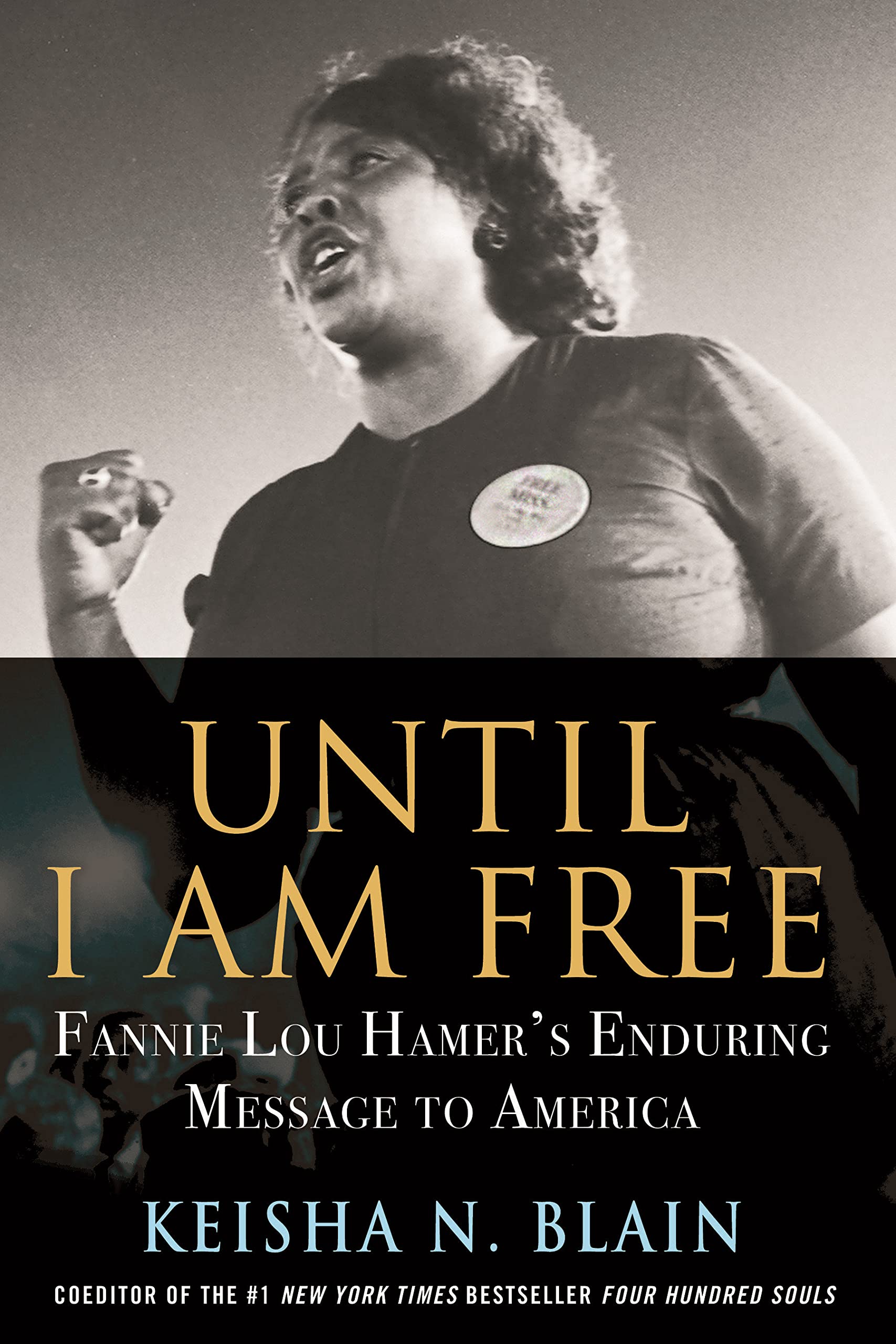 Cover of Until I Am Free: Fannie Lou Hamer looking determined and holding up a fist